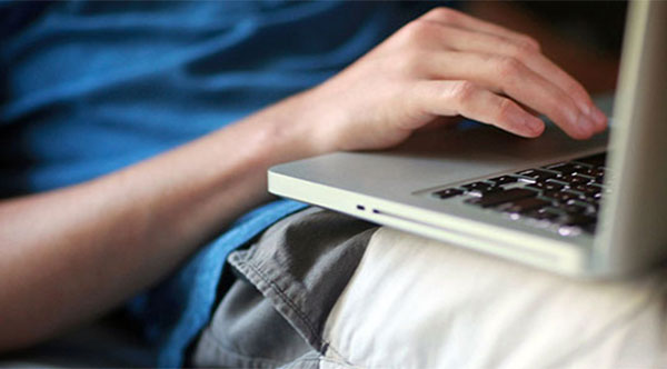 home alone teen using a laptop