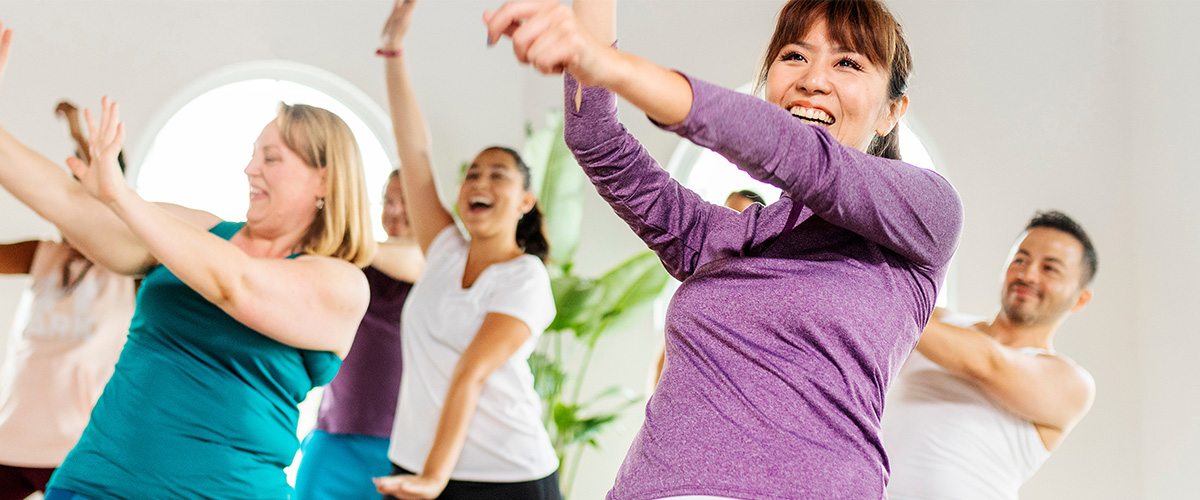 Group of adults dancing for fitness